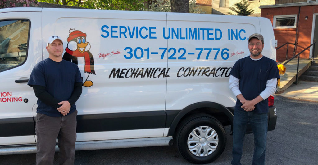 Service Unlimited van with HVAC employees
