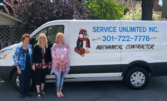 Service Unlimited van with 3 ladies