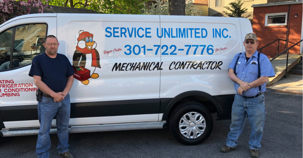 Service Unlimited van with plumbing employees